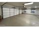 A large two-car garage is clean, empty, and ready for storage or parking at 4511 S 181St Ave, Goodyear, AZ 85338