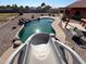 Backyard swimming pool featuring a slide, rock waterfall and stone landscaping at 4511 S 181St Ave, Goodyear, AZ 85338