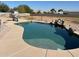 Backyard pool with a rock waterfall feature and water slide offers hours of outdoor fun at 4511 S 181St Ave, Goodyear, AZ 85338