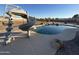 The pool with a slide offers a fun, outdoor space at 4511 S 181St Ave, Goodyear, AZ 85338