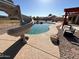 A backyard pool with slide and pergola offers lots of outdoor entertainment options at 4511 S 181St Ave, Goodyear, AZ 85338