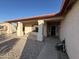 Covered front porch with view of desert landscaping, decorative pillars, and shade at 4511 S 181St Ave, Goodyear, AZ 85338