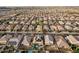 Expansive neighborhood aerial view showcasing many homes with varied architectural styles at 4521 W Maggie Dr, San Tan Valley, AZ 85144