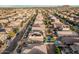 Bird's eye view featuring neighborhood streets, varied home styles, solar panels, and sparkling backyard pools at 4521 W Maggie Dr, San Tan Valley, AZ 85144