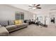 Bonus room with lounge area and exercise equipment, lit by a contemporary ceiling fan at 4521 W Maggie Dr, San Tan Valley, AZ 85144