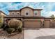 Charming two-story home with a three car garage and meticulously landscaped front yard at 4521 W Maggie Dr, San Tan Valley, AZ 85144