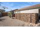 The backyard has decorative rock fencing along the property perimeter, adding a touch of elegance at 4665 S Palacio Way, Gold Canyon, AZ 85118