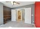 Bedroom with gray walls, built-in shelving, and connecting bathroom at 4665 S Palacio Way, Gold Canyon, AZ 85118