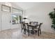 Bright dining area with a large window and modern lighting, perfect for entertaining guests at 4665 S Palacio Way, Gold Canyon, AZ 85118