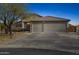 A well-maintained driveway leads to a spacious three-car garage, and the desert landscaping frames the entrance at 4665 S Palacio Way, Gold Canyon, AZ 85118