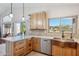 Bright kitchen with an island, stainless steel appliances, and a view of the backyard at 4665 S Palacio Way, Gold Canyon, AZ 85118