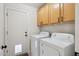 Laundry room with washer, dryer and upper cabinets at 4665 S Palacio Way, Gold Canyon, AZ 85118