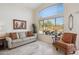 Cozy living room with comfortable seating, a large window, and stylish decor elements at 4665 S Palacio Way, Gold Canyon, AZ 85118