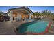 Inviting backyard pool and covered patio area, perfect for relaxing and entertaining at 4665 S Palacio Way, Gold Canyon, AZ 85118