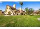 View of townhomes and lush green grass, showcasing the community's well-maintained landscaping at 4901 S Calle Los Cerros Dr # 264, Tempe, AZ 85282