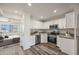 Modern kitchen featuring white cabinets, stainless steel appliances, and gray countertops at 4901 S Calle Los Cerros Dr # 264, Tempe, AZ 85282