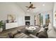 Staged living room with fireplace, wood-look floors, and patio doors at 4901 S Calle Los Cerros Dr # 264, Tempe, AZ 85282