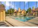 Inviting community pool with palm trees, and ample deck space for lounging at 4901 S Calle Los Cerros Dr # 264, Tempe, AZ 85282