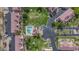 Top-down view of a condo community pool with adjacent lounge and palm tree landscaping at 4901 S Calle Los Cerros Dr # 264, Tempe, AZ 85282