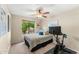 Bright bedroom with a ceiling fan, view from the window, and workout equipment at 5024 E Le Marche Ave, Scottsdale, AZ 85254