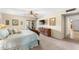 Bedroom featuring a ceiling fan, a dresser, and a sliding glass door to the outside patio at 5024 E Le Marche Ave, Scottsdale, AZ 85254