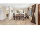 Elegant dining room with a chandelier, large mirror, and a view into the kitchen at 5024 E Le Marche Ave, Scottsdale, AZ 85254