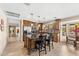 Spacious kitchen with dark wood cabinets, stainless appliances, and a large center island at 5024 E Le Marche Ave, Scottsdale, AZ 85254