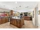 Open kitchen featuring an island with granite countertops, stainless appliances, and seating at 5024 E Le Marche Ave, Scottsdale, AZ 85254