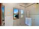 Shower with glass doors and tennis court view at 5567 E Mcdonald Dr, Paradise Valley, AZ 85253