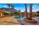 Backyard pool with mature palm trees and mountain views at 5567 E Mcdonald Dr, Paradise Valley, AZ 85253