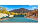 Outdoor tennis court with mountain views at 5567 E Mcdonald Dr, Paradise Valley, AZ 85253