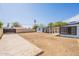 Spacious backyard featuring a large patio, accessory building and a covered structure at 5731 W Morten Ave, Glendale, AZ 85301