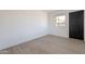 This bedroom features new wood floors and a window at 5731 W Morten Ave, Glendale, AZ 85301