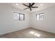 Sunny bedroom with neutral walls, sleek floors, and a ceiling fan to ensure your comfort at 5731 W Morten Ave, Glendale, AZ 85301