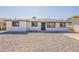 Single-story home showcasing a modern design and xeriscaped front yard for easy upkeep at 5731 W Morten Ave, Glendale, AZ 85301