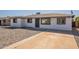 Well-maintained home featuring a concrete driveway and minimalistic rock landscaping in the front yard at 5731 W Morten Ave, Glendale, AZ 85301