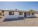 Charming single-story home featuring a neutral color scheme and low-maintenance gravel landscaping at 5731 W Morten Ave, Glendale, AZ 85301