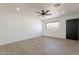 Bright living room with updated flooring, recessed lighting, ceiling fan, and neutral paint at 5731 W Morten Ave, Glendale, AZ 85301