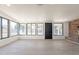 Bright living room with lots of windows and an accent brick wall at 5731 W Morten Ave, Glendale, AZ 85301