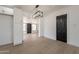 Contemporary dining area with modern light fixture, adjacent to a room with updated flooring at 5731 W Morten Ave, Glendale, AZ 85301