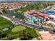 Aerial view showcases the lush golf course, sparkling pool, and well-maintained tennis courts at 6177 S Sawgrass Dr, Chandler, AZ 85249