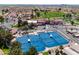 Gorgeous aerial shot of the community featuring tennis courts, lush landscaping, and charming homes at 6177 S Sawgrass Dr, Chandler, AZ 85249