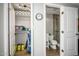 View of open closet with storage shelves and a view to the bathroom with modern shower at 6177 S Sawgrass Dr, Chandler, AZ 85249