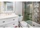 Bathroom with tiled walk-in shower featuring a glass door, and vanity with white countertop, and cabinets at 6177 S Sawgrass Dr, Chandler, AZ 85249