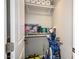 Storage closet with built-in shelving for sports equipment and household supplies at 6177 S Sawgrass Dr, Chandler, AZ 85249