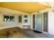 Exterior view of home with a covered porch, outdoor bench and decorative glass doors at 6177 S Sawgrass Dr, Chandler, AZ 85249