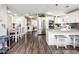 Bright kitchen with modern stainless steel appliances, granite countertops, and adjacent dining area at 6177 S Sawgrass Dr, Chandler, AZ 85249