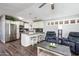 Cozy living room and kitchen featuring an open layout, modern appliances, and stylish decor at 6177 S Sawgrass Dr, Chandler, AZ 85249