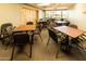 Inviting meeting room with tables and chairs, complemented by soft lighting and view of the golf course at 6177 S Sawgrass Dr, Chandler, AZ 85249