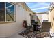 Comfortable patio with a firepit table, seating and overhead string lights, providing a warm and inviting ambiance at 6177 S Sawgrass Dr, Chandler, AZ 85249